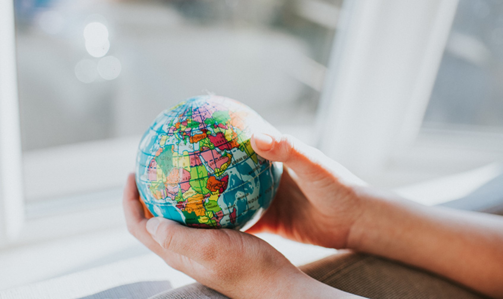 hand holding globe